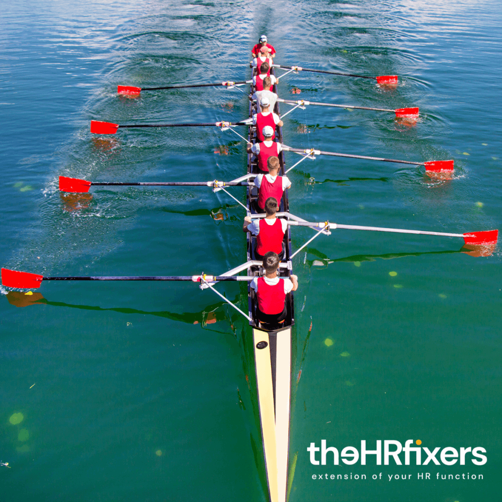 A boat being rowed in unison.